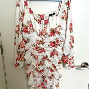 White midi dress. Ruched sides and floral print. Back zip. Never worn or used.
